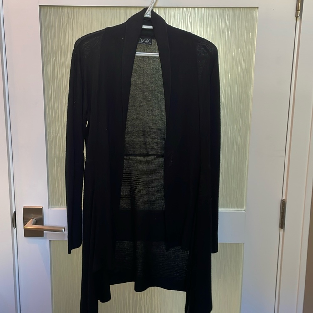 Black asymmetrical sweater duster. Mid thigh length.